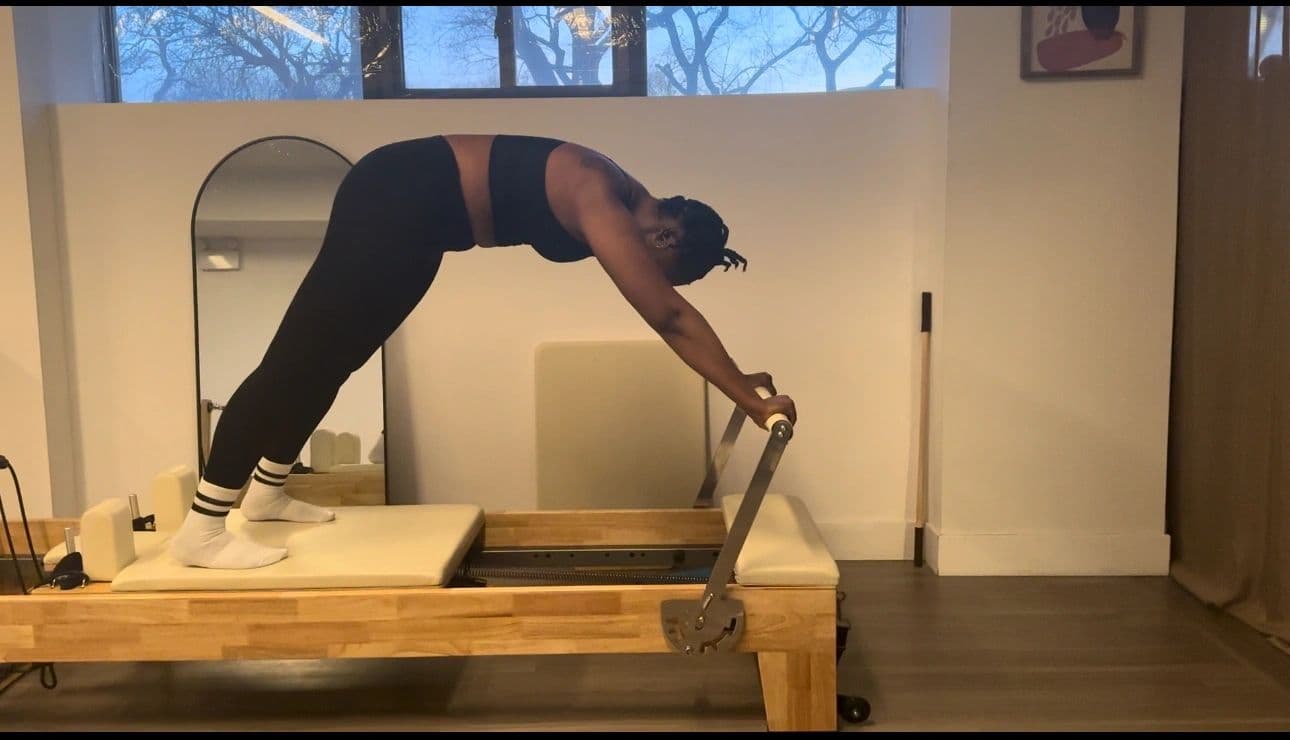 A client working on the reformer in a one to one session